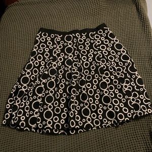 Ann Taylor skirt flares outward. Never worn!